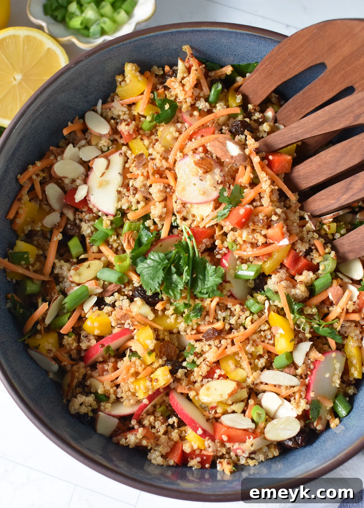 Curried Quinoa Salad served in a blue bowl.