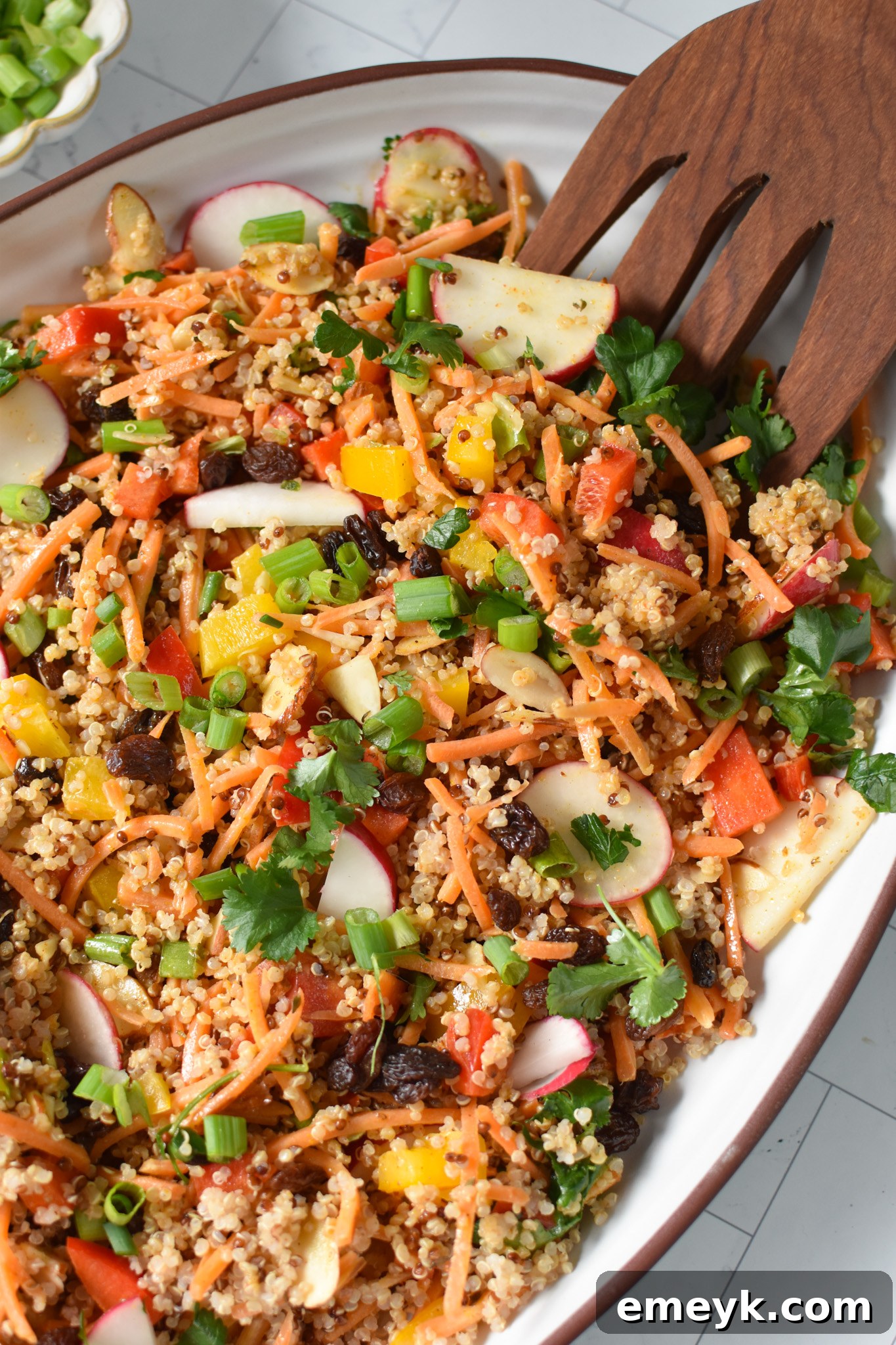 Curried Quinoa Salad elegantly arranged on a white platter.