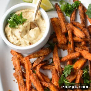 Golden Roasted Carrot Fries 8 Oven Baked Carrot Fries on a white oval plate.