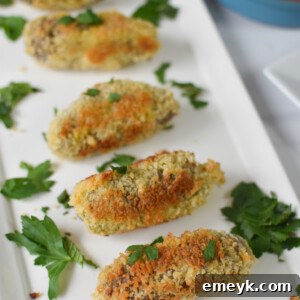 Gourmet Lamb Croquettes 9 Lamb Croquettes on a white plate.