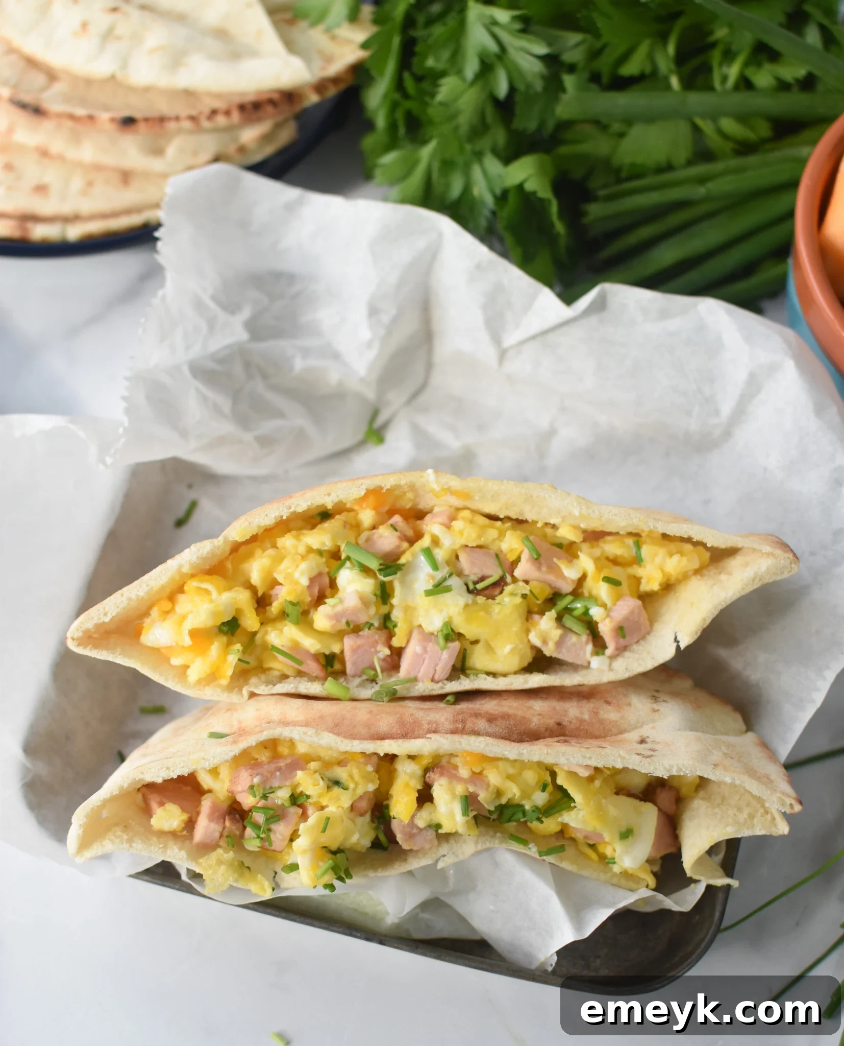 Sunrise Pita Pockets 6 A Breakfast Pita Recipe nestled in a rustic tin, perfect for a picnic or packed lunch.