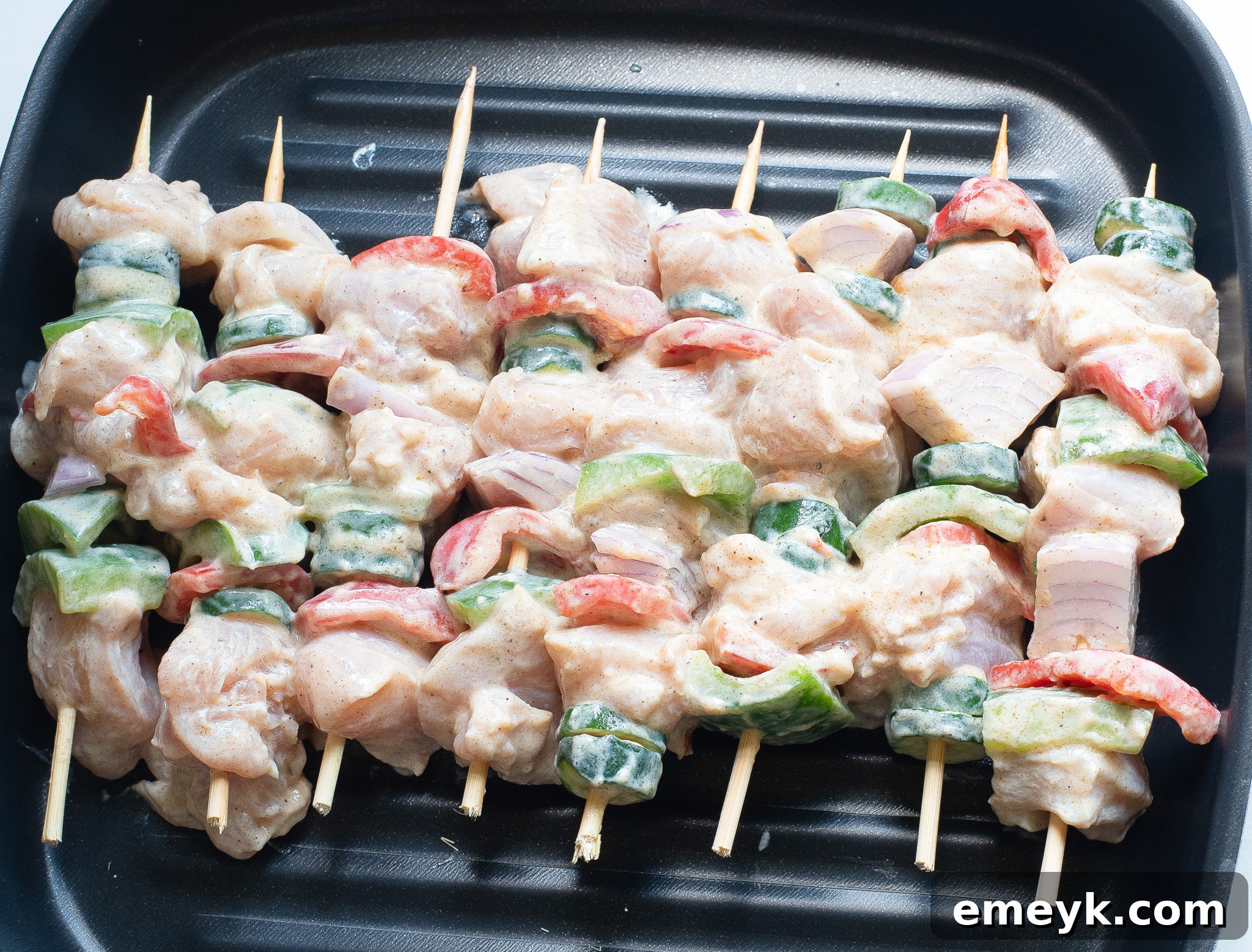 Lemon-Herb Mediterranean Chicken Skewers 6 Served Greek Marinated Chicken Kabobs with Lemon on a grill rack after cooking.