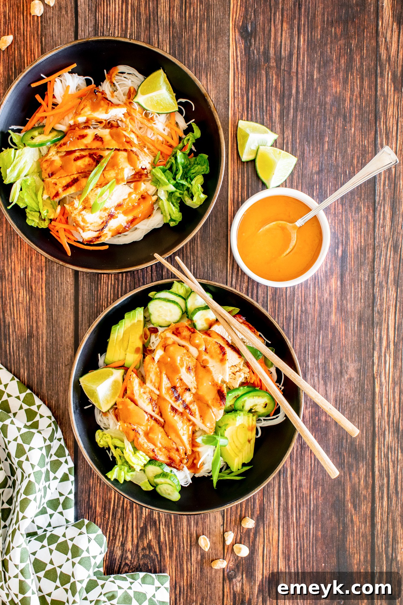 Thai Chicken Noodle Salad drizzled with its creamy peanut sauce, ready for enjoyment.