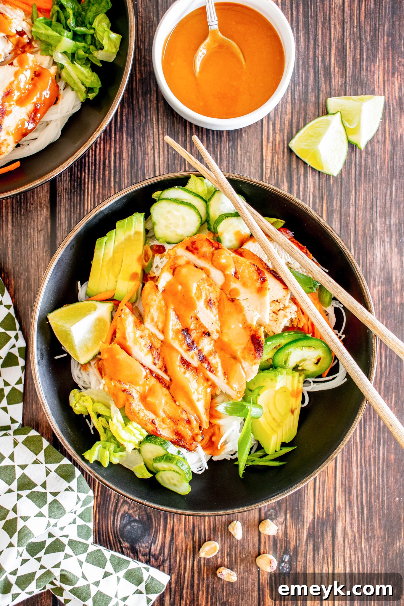 Finished Thai Chicken Noodle Salad served with chopsticks, ready to be enjoyed.