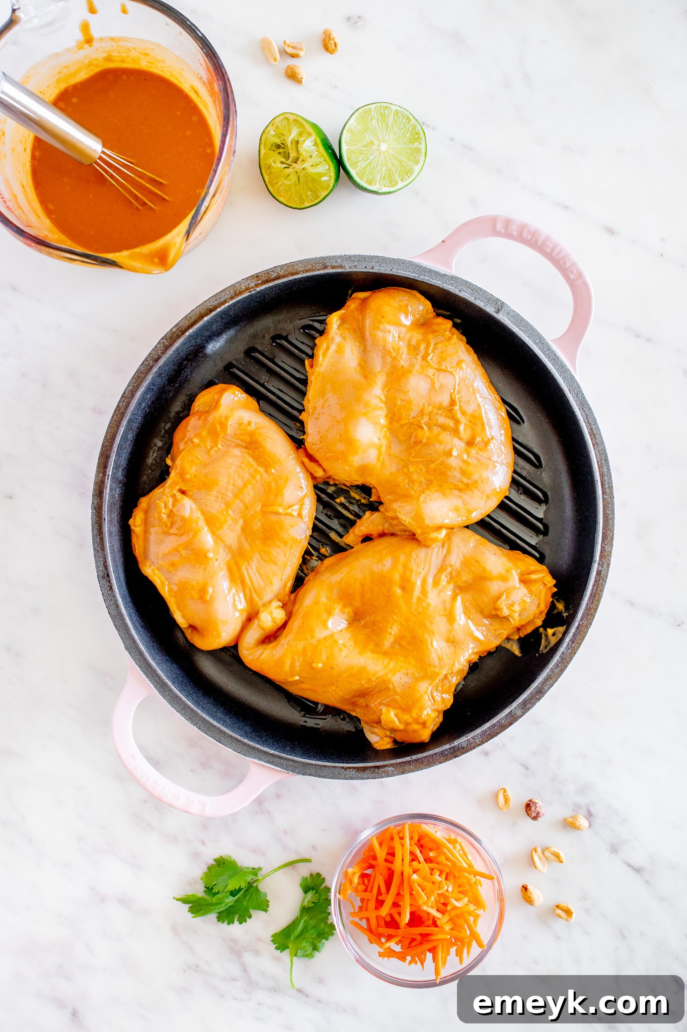 Chicken breasts grilling on a hot grill pan, developing a beautiful char.
