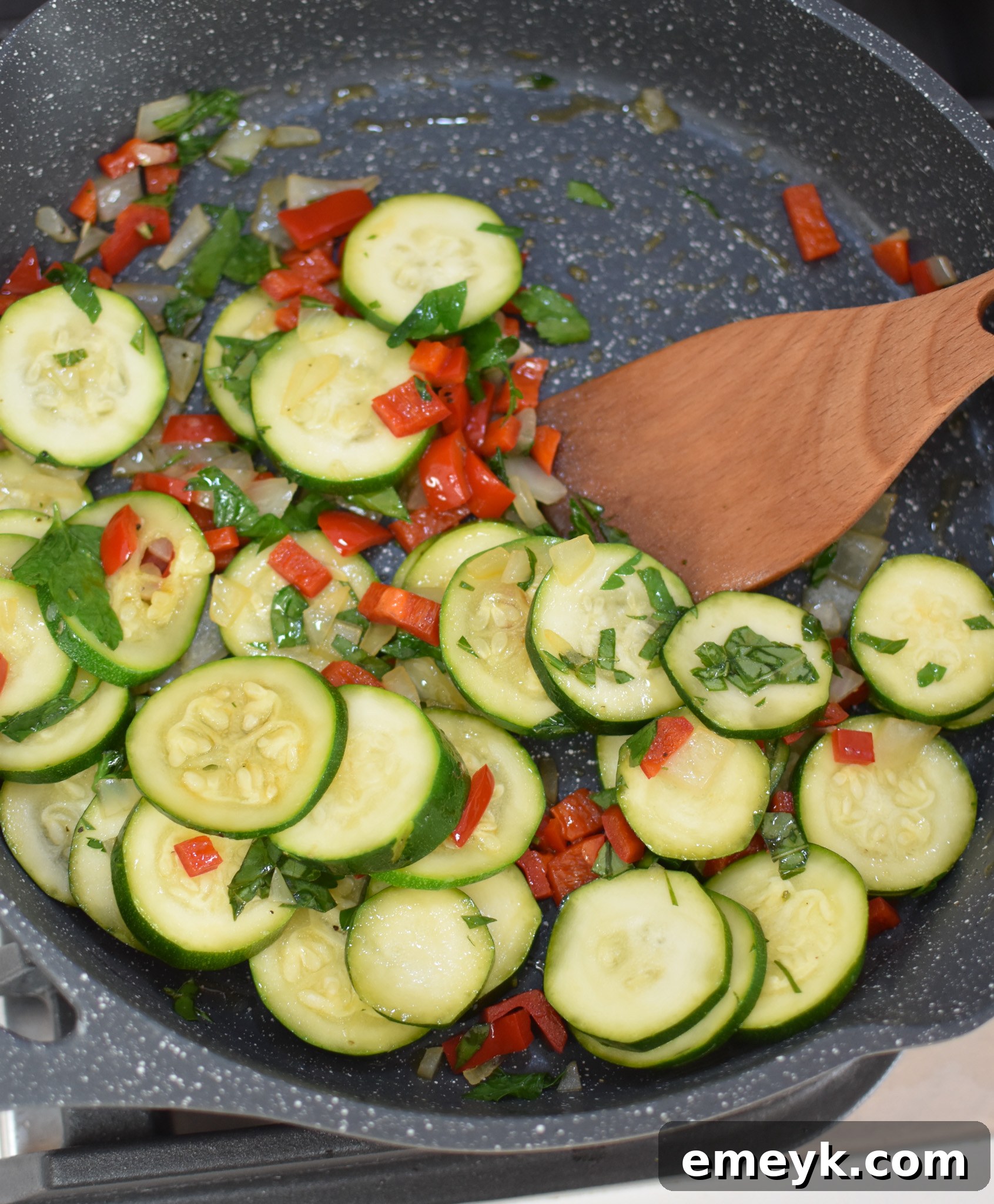 Zucchini Frittata Recipe sautéed vegetables in a skillet.