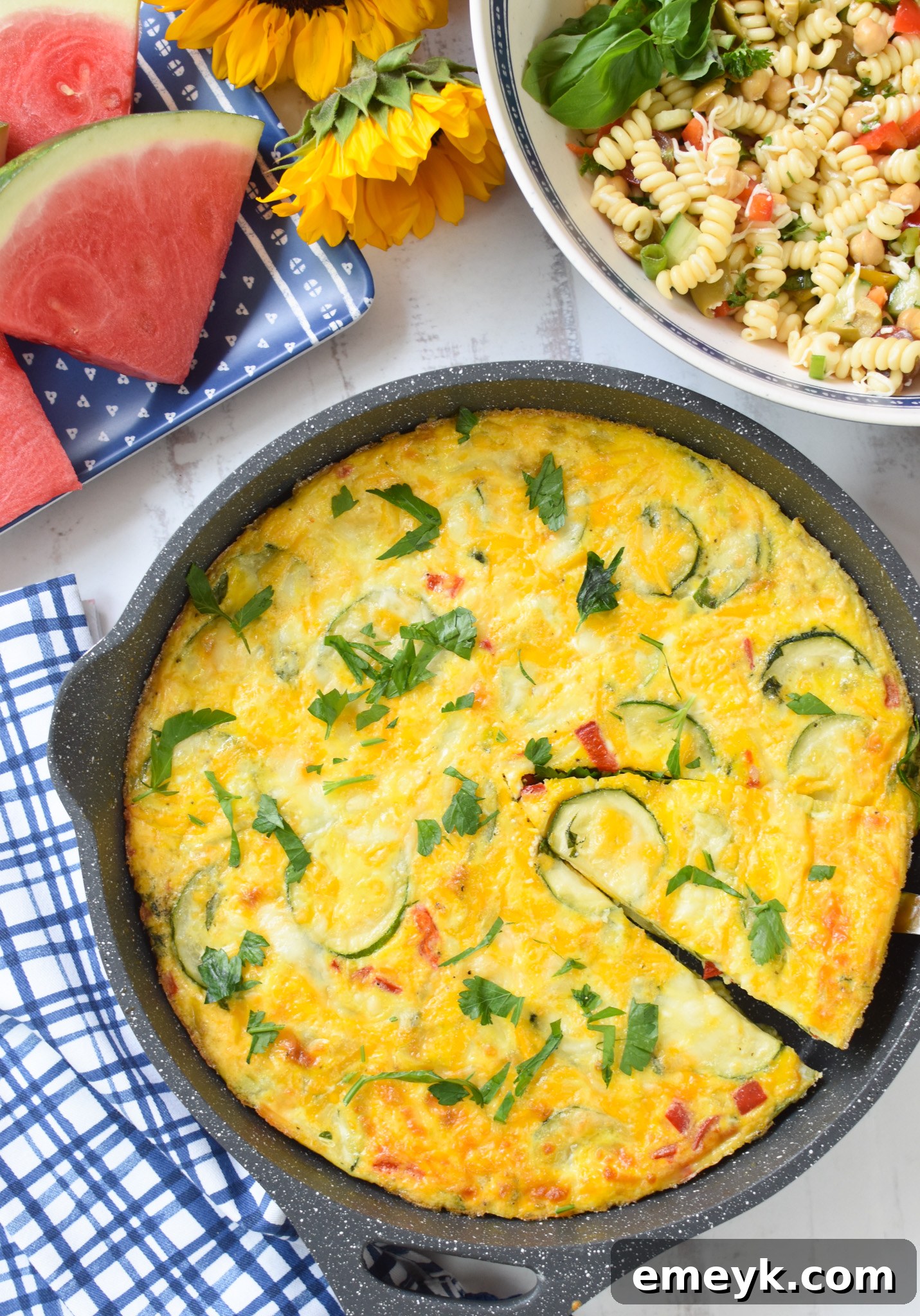 Zucchini Frittata Recipe cooling on a blue napkin.