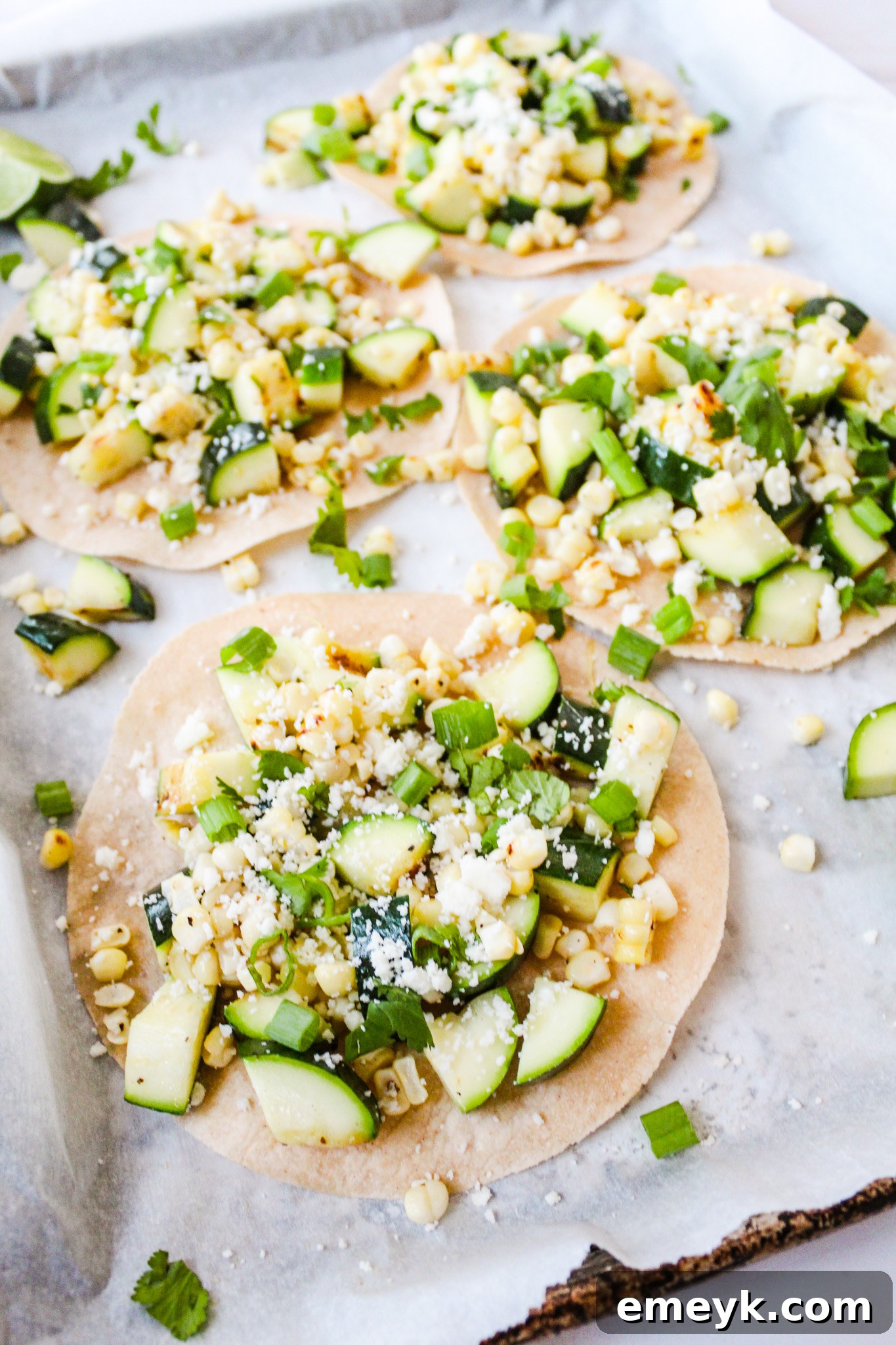 A baking sheet filled with Easy Zucchini Tacos, neatly arranged.
