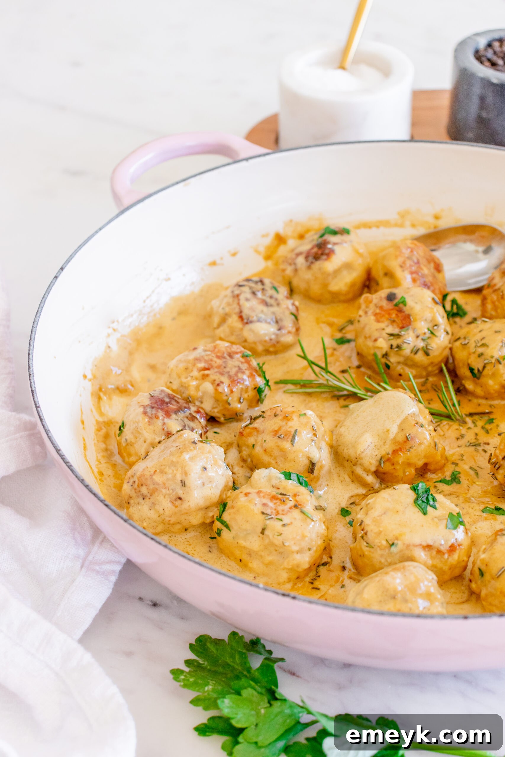 Maple Dijon Turkey Meatballs ready to be served with a spoon.