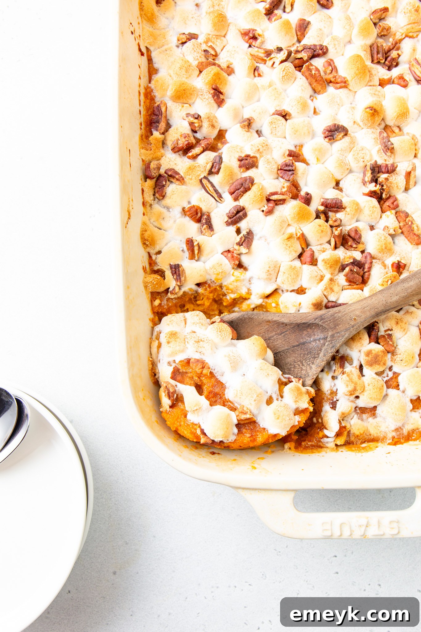 Sweet Potato Casserole with Marshmallows in a casserole dish, ready to be served
