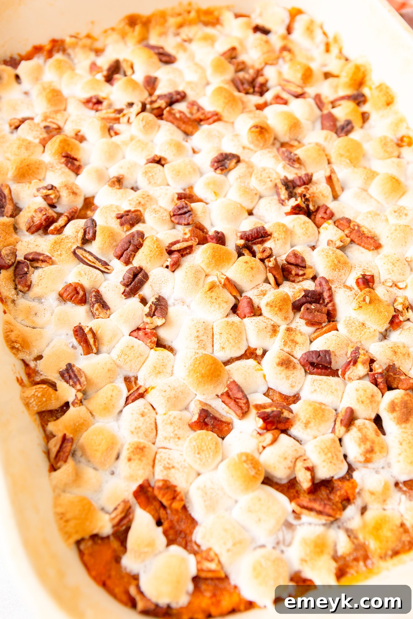 Sweet Potato Casserole with Marshmallows up close, showing the toasted topping