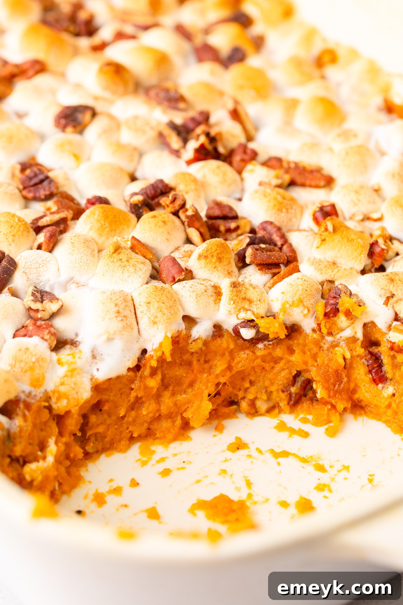 Sweet Potato Casserole with Marshmallows inside of the casserole dish