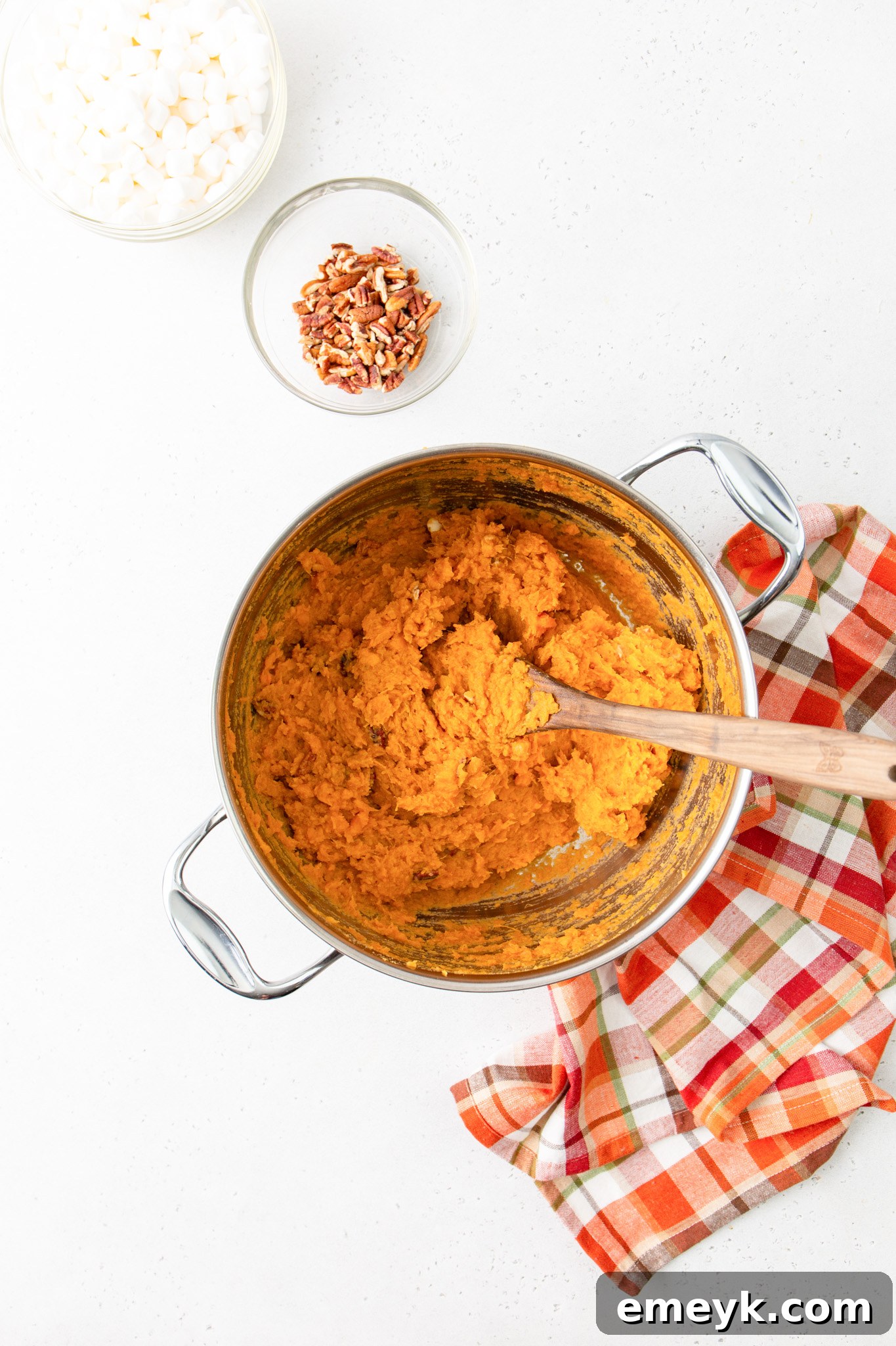 Sweet Potato Casserole with Marshmallows potatoes in a pot with added ingredients