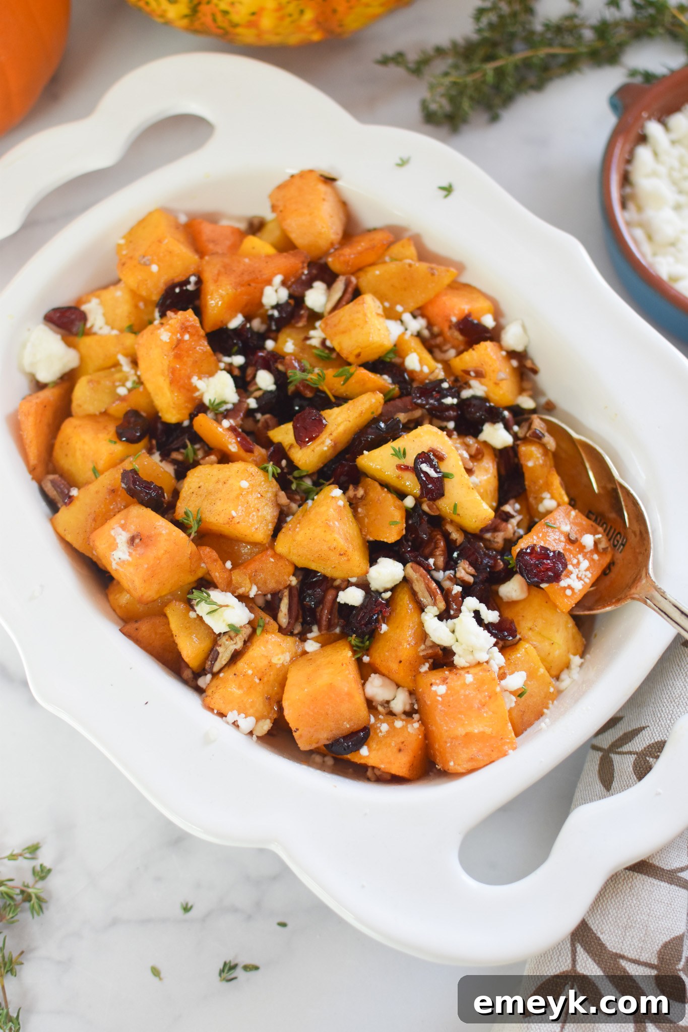 Roasted Butternut Squash with Cranberries with spoon