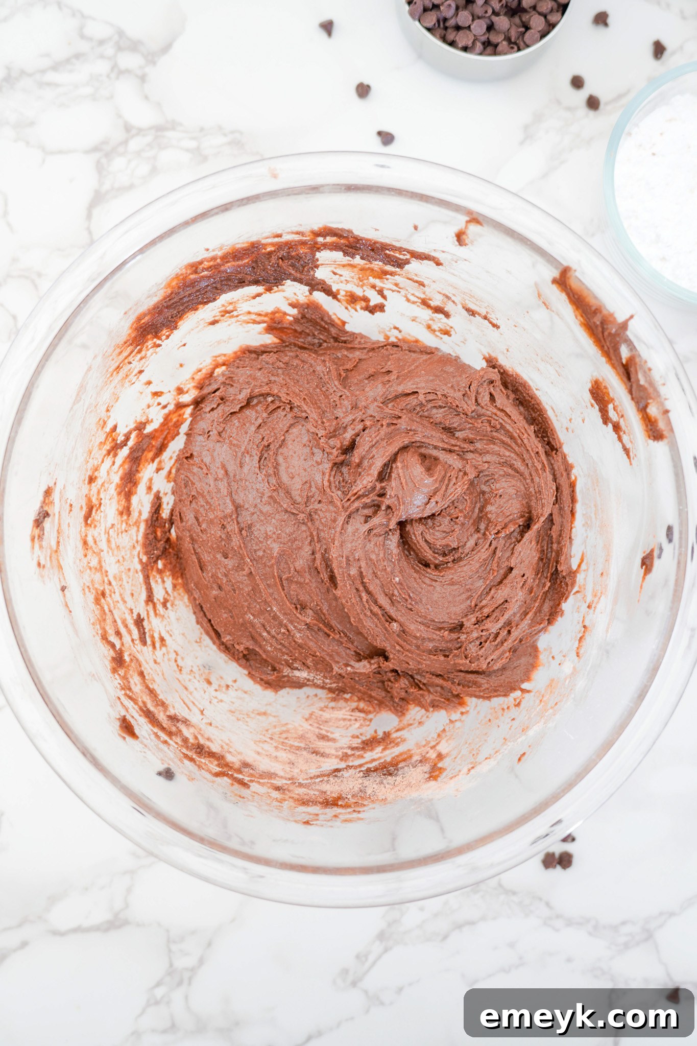 Chocolate Crinkle Cookie dough fully mixed in a bowl, showing its rich, dark consistency.