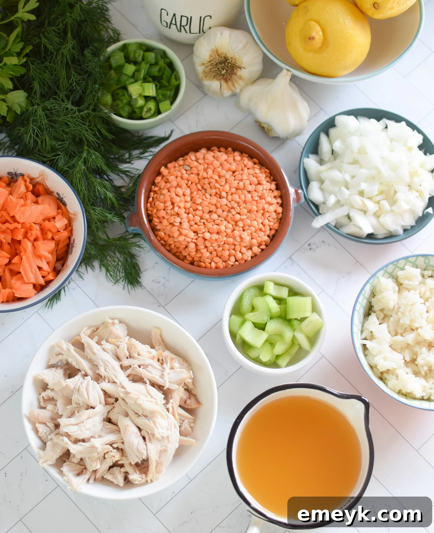 Bowl of fresh ingredients for Chicken Lentil Soup, including diced vegetables, lentils, and spices.