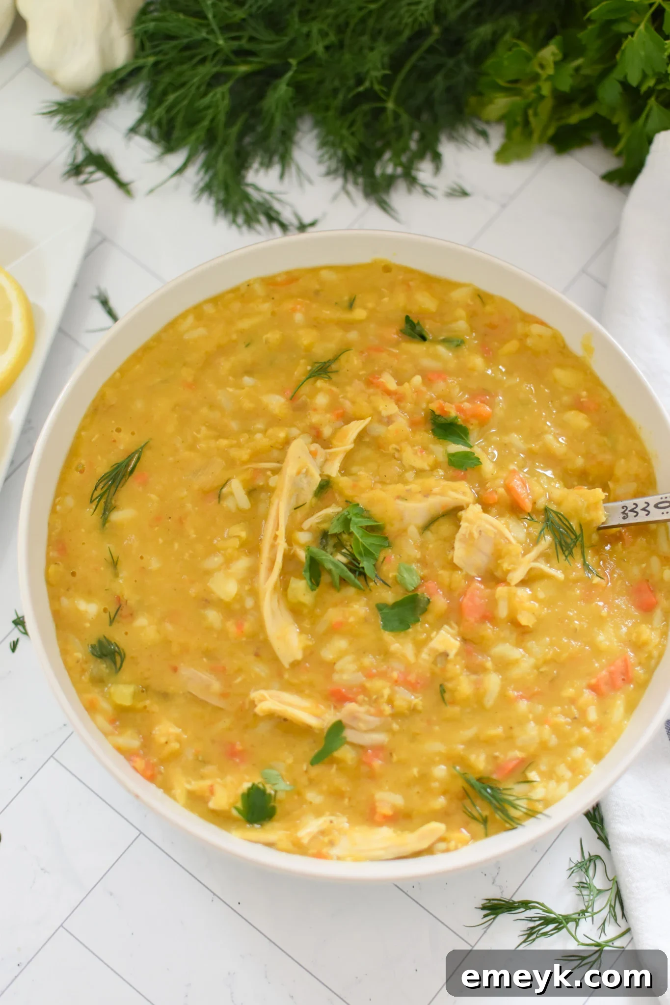 Chicken Lentil Soup served with a spoon, showing its thick and hearty consistency.