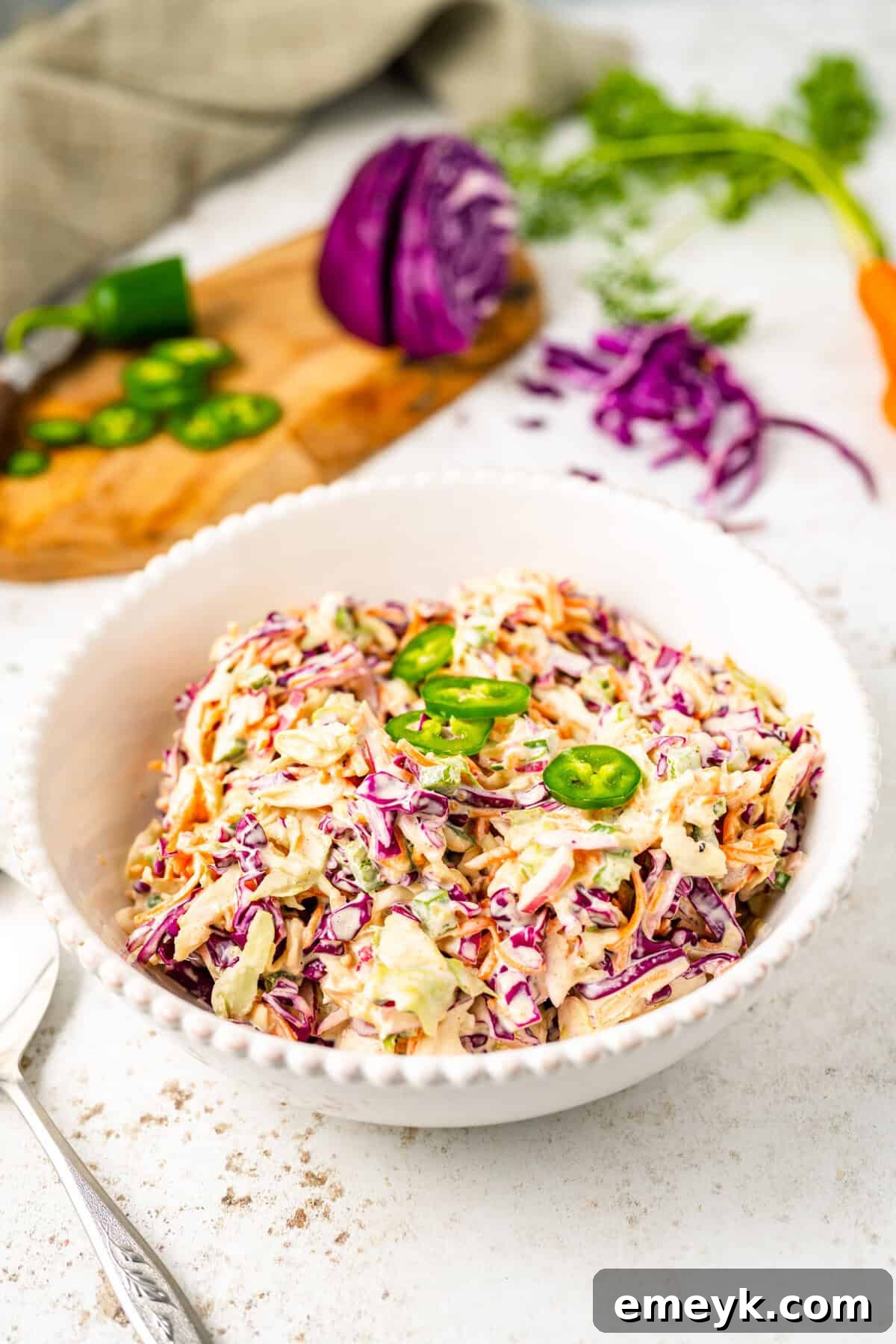 Kickin Jalapeno Coleslaw 3 A close-up of fresh Jalapeño Coleslaw served in a white bowl, ready to be enjoyed.