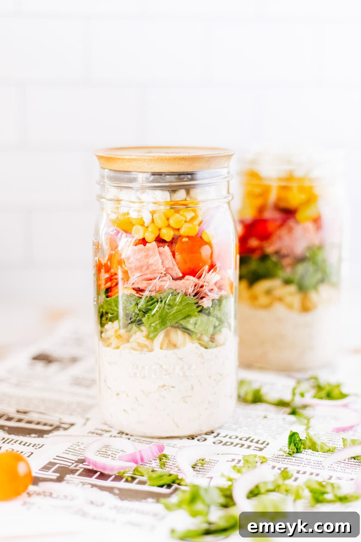 Vibrant Italian Pasta Mason Jar Salad, perfectly layered in a glass jar with a lid, ready for a delicious meal.