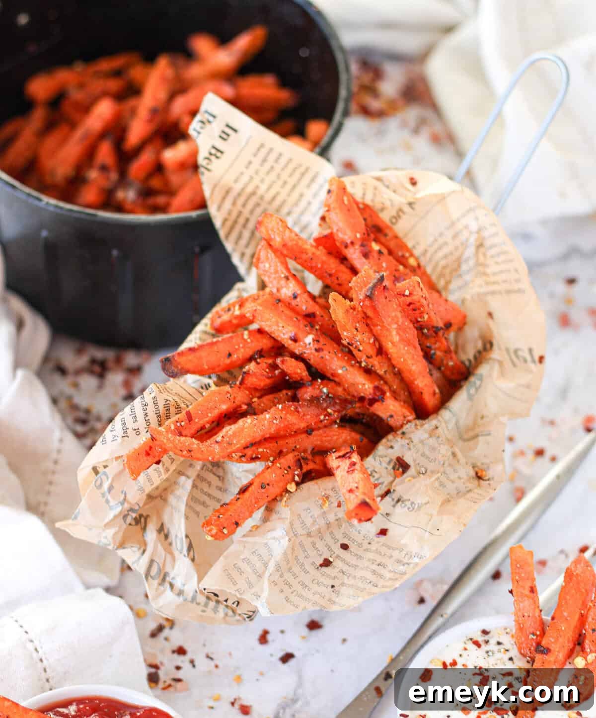 Air Fryer Sweet Potato Fries in a cup, perfectly golden and crispy