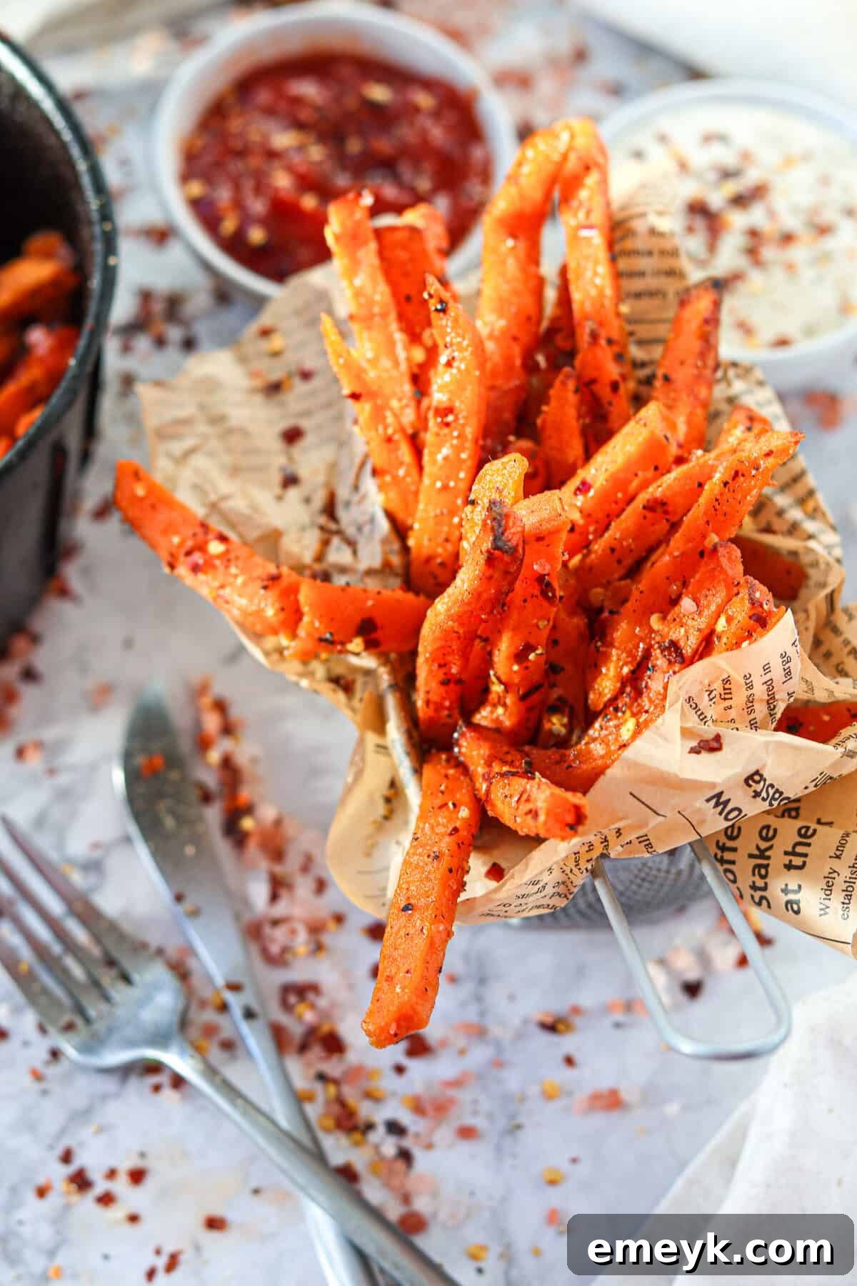 Air Fryer Sweet Potato Fries in a cup lined with parchment paper
