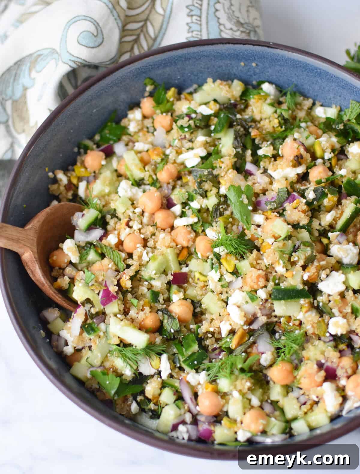The Secret to Jennifer Aniston's Viral Salad Sensation 8 salad ingredients combined in a salad bowl.