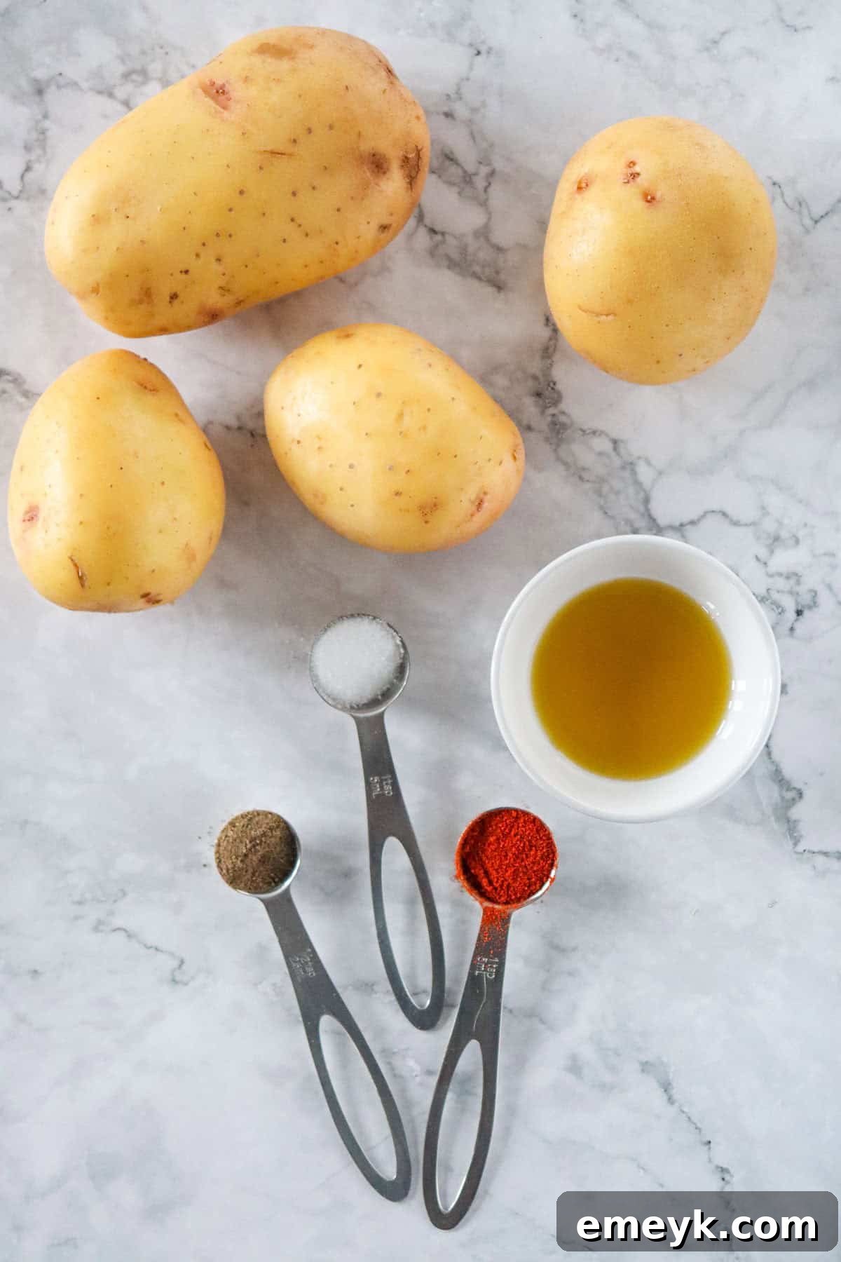 Ingredients for Air Fryer French Fries including potatoes, olive oil, and spices
