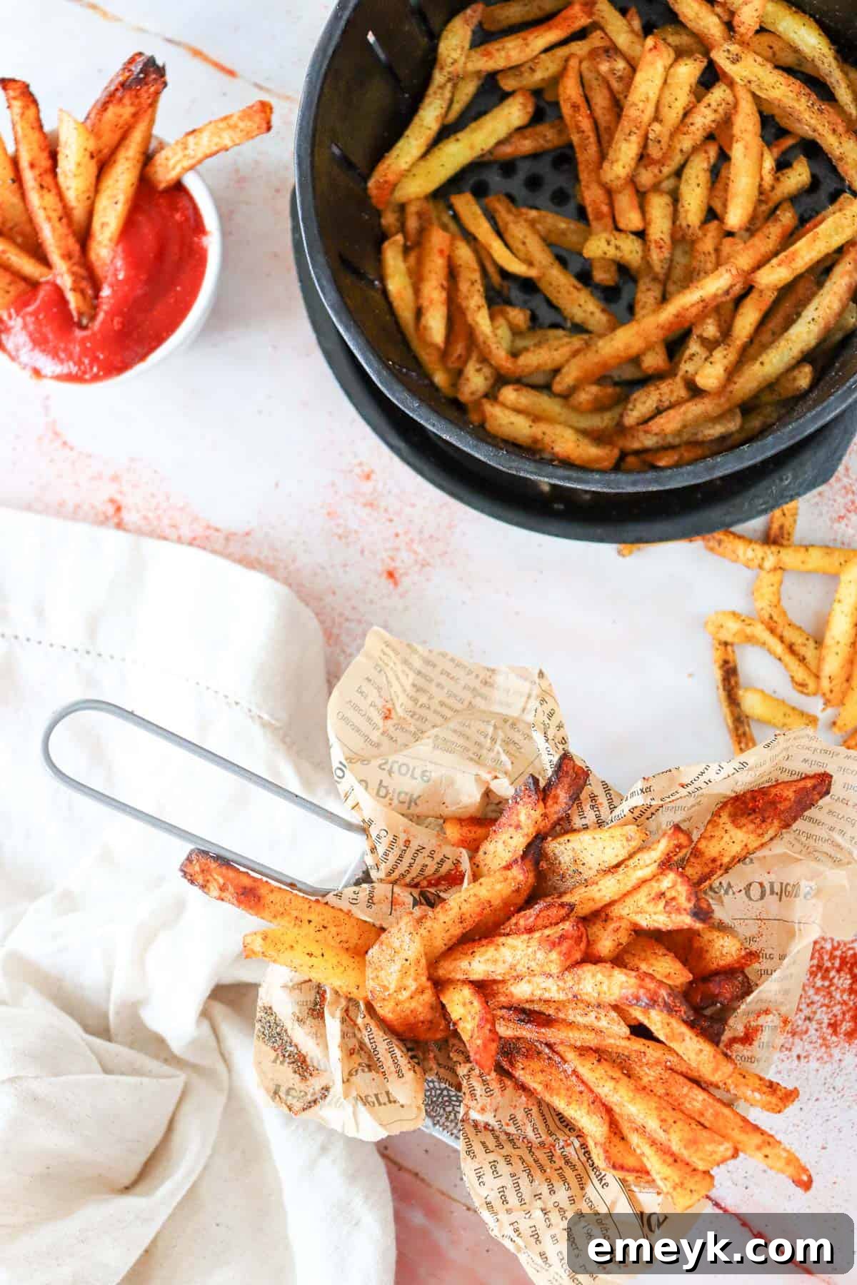 A basket brimming with freshly made, crispy Air Fryer French Fries