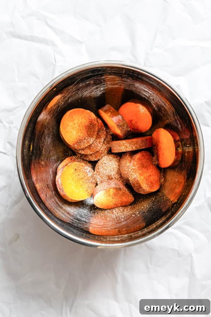 Seasoned sweet potato rounds in a bowl