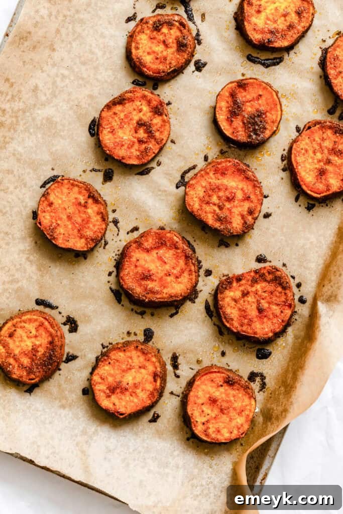 Roasted sweet potato rounds on a baking sheet