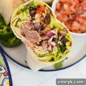 Smoked Pork Burrito Sensations 11 A well-crafted Pulled Pork Burrito, showcasing its delicious filling and golden tortilla