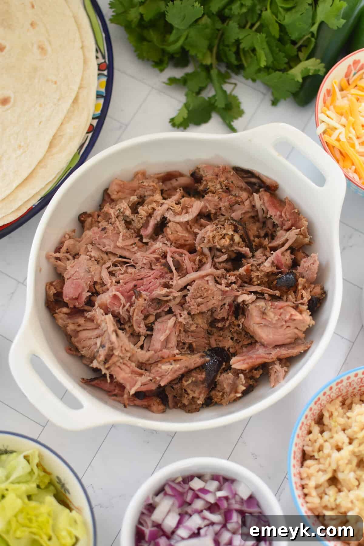 Smoked Pork Burrito Sensations 5 Close-up of seasoned pulled pork mixture in a bowl, perfectly prepared and ready for burrito assembly