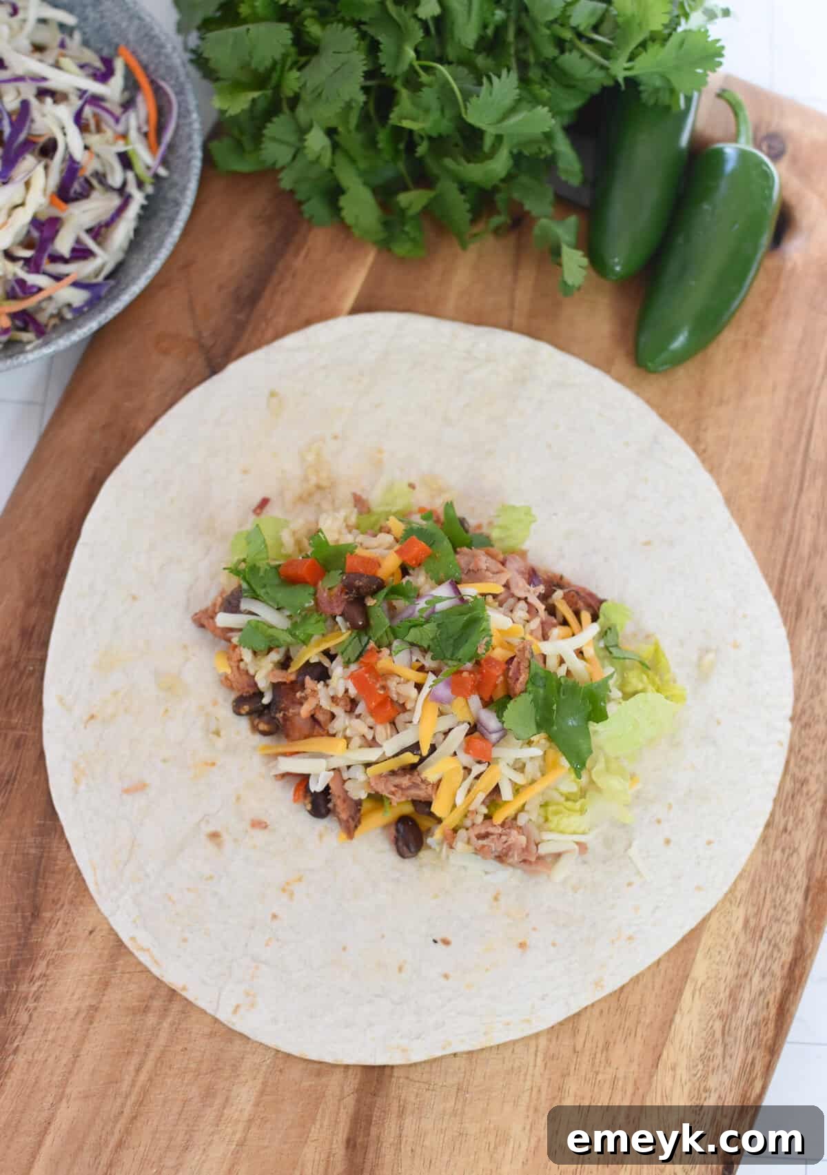 Smoked Pork Burrito Sensations 8 Pulled Pork Burrito filling expertly arranged on a warm tortilla, perfectly poised for folding