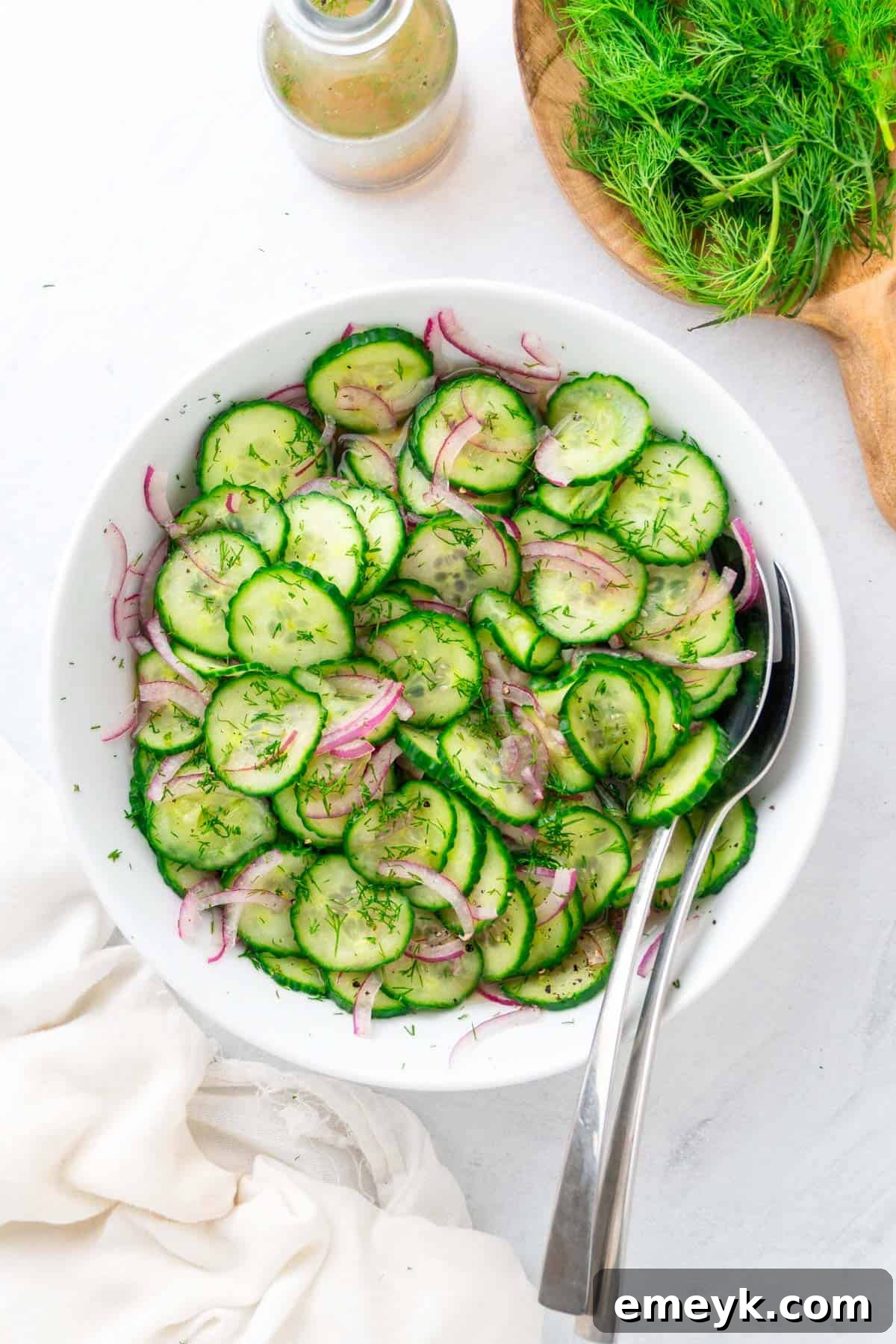 Cucumber Onion Salad with serving spoons