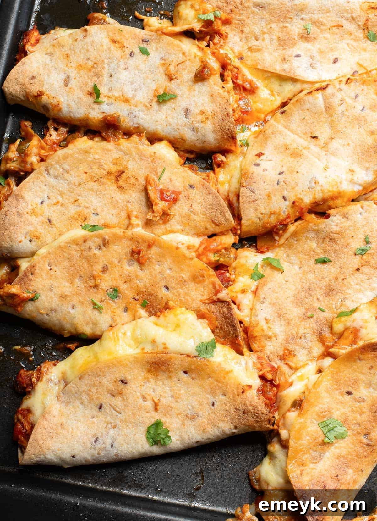 Baked Chicken Tacos on a baking sheet, golden brown and delicious