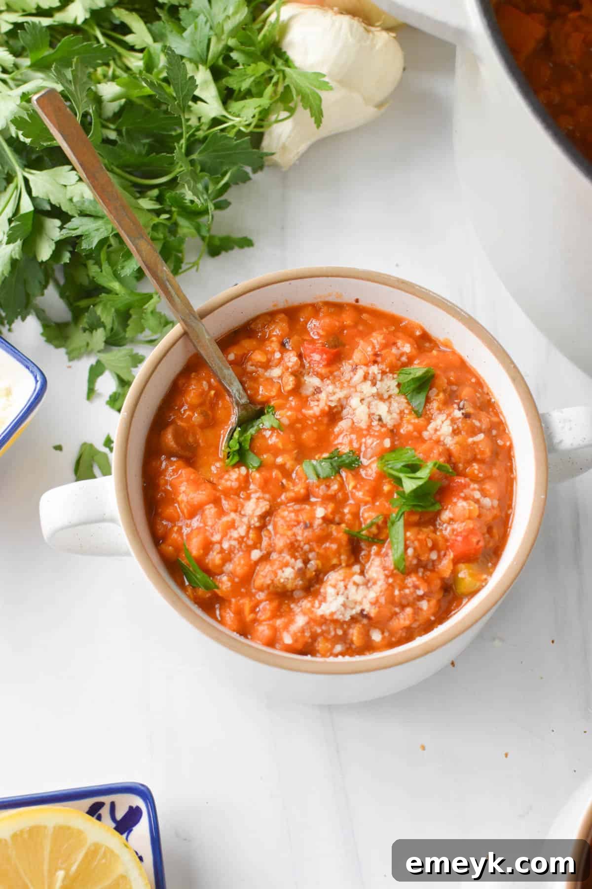 Lentil Sausage Soup served in a bowl with a spoon, ready to eat
