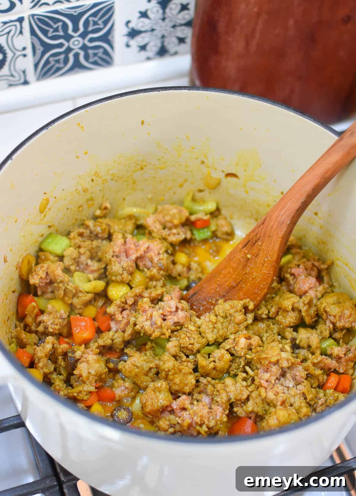 Sausage and lentils cooking together in a large pot