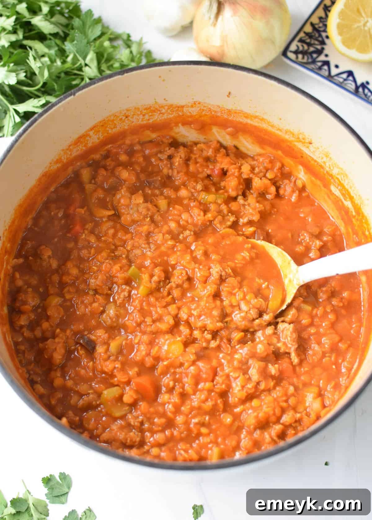 Lentil Sausage Soup cooking in a dutch oven