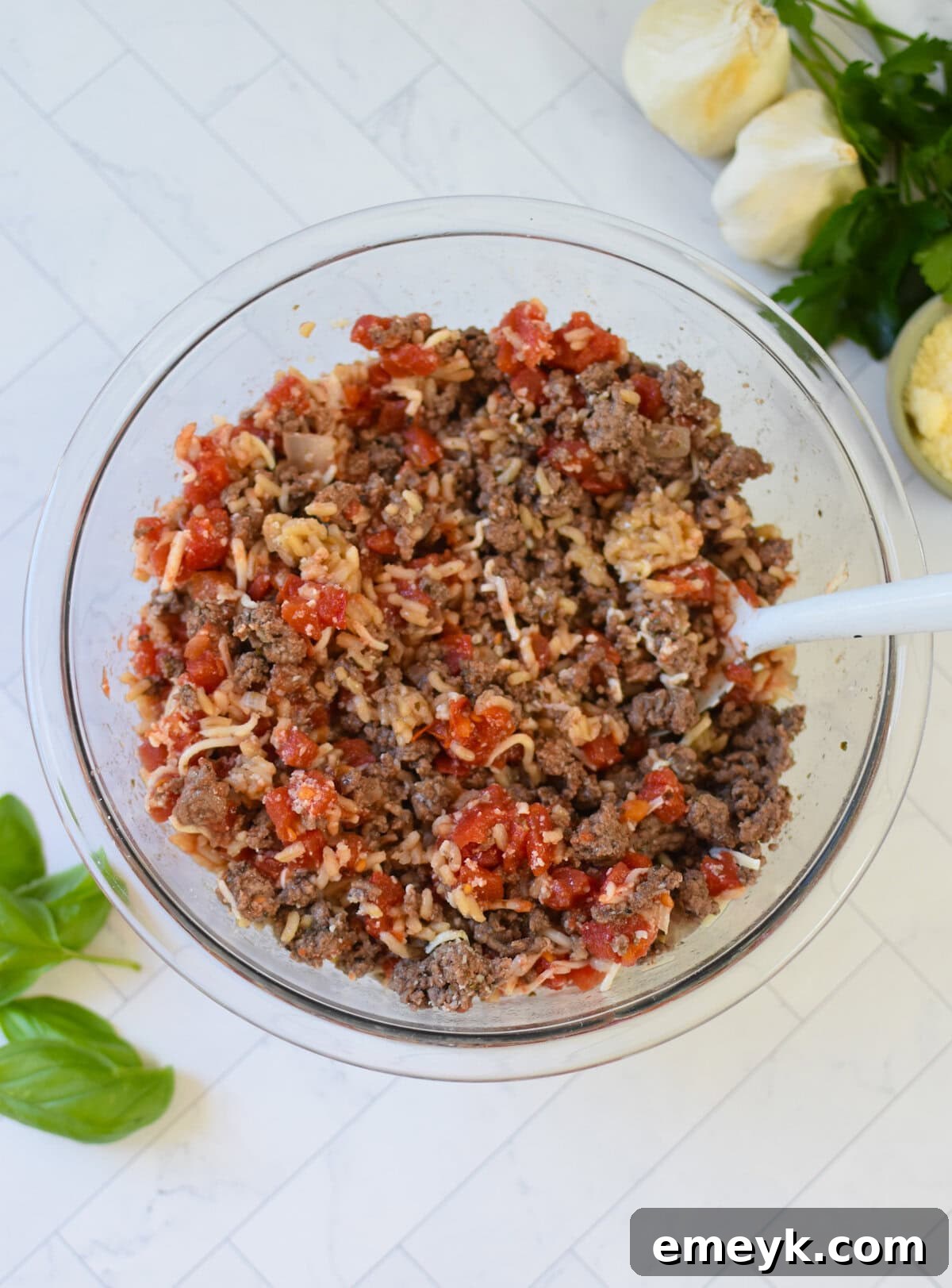 Beef, rice, and cheese mixture in a bowl, ready to be stuffed into peppers.