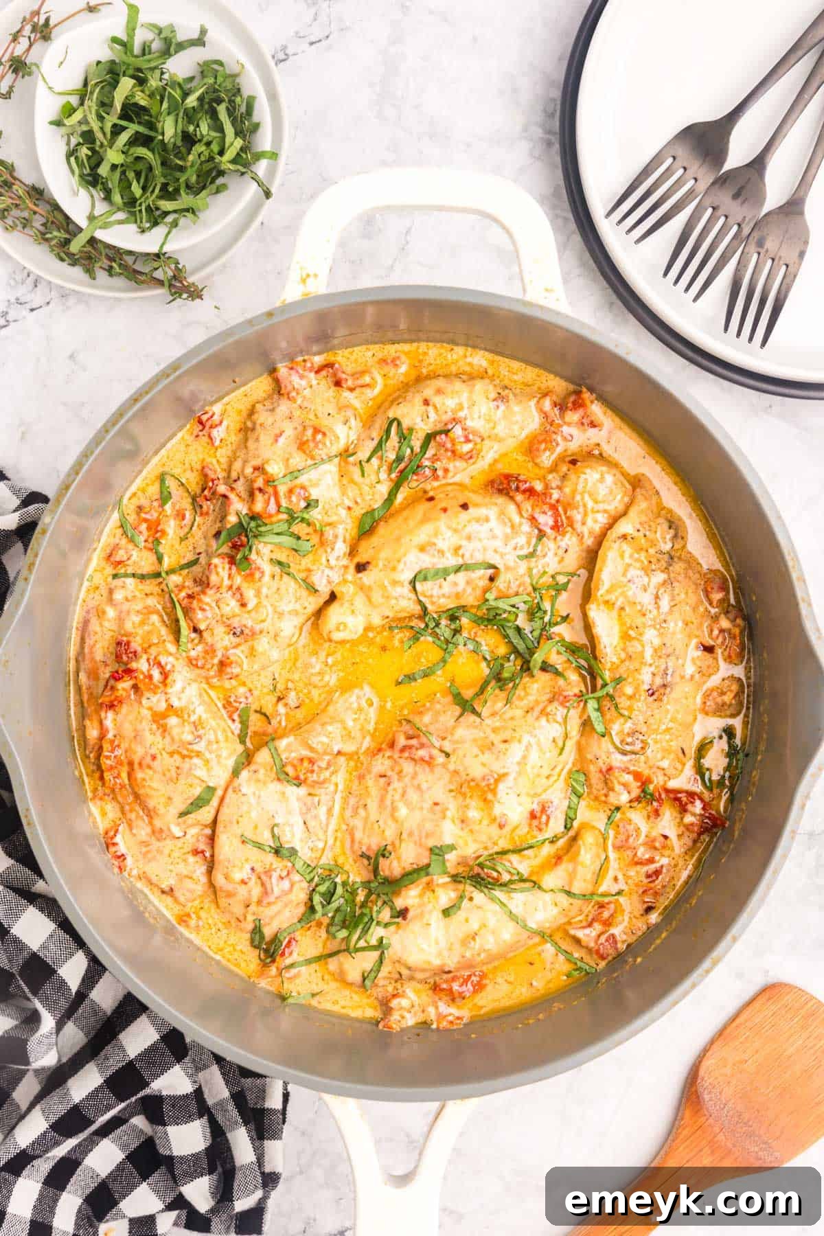 Marry Me Chicken sauce, rich with sun-dried tomatoes and herbs, simmering in a skillet, almost ready to serve.
