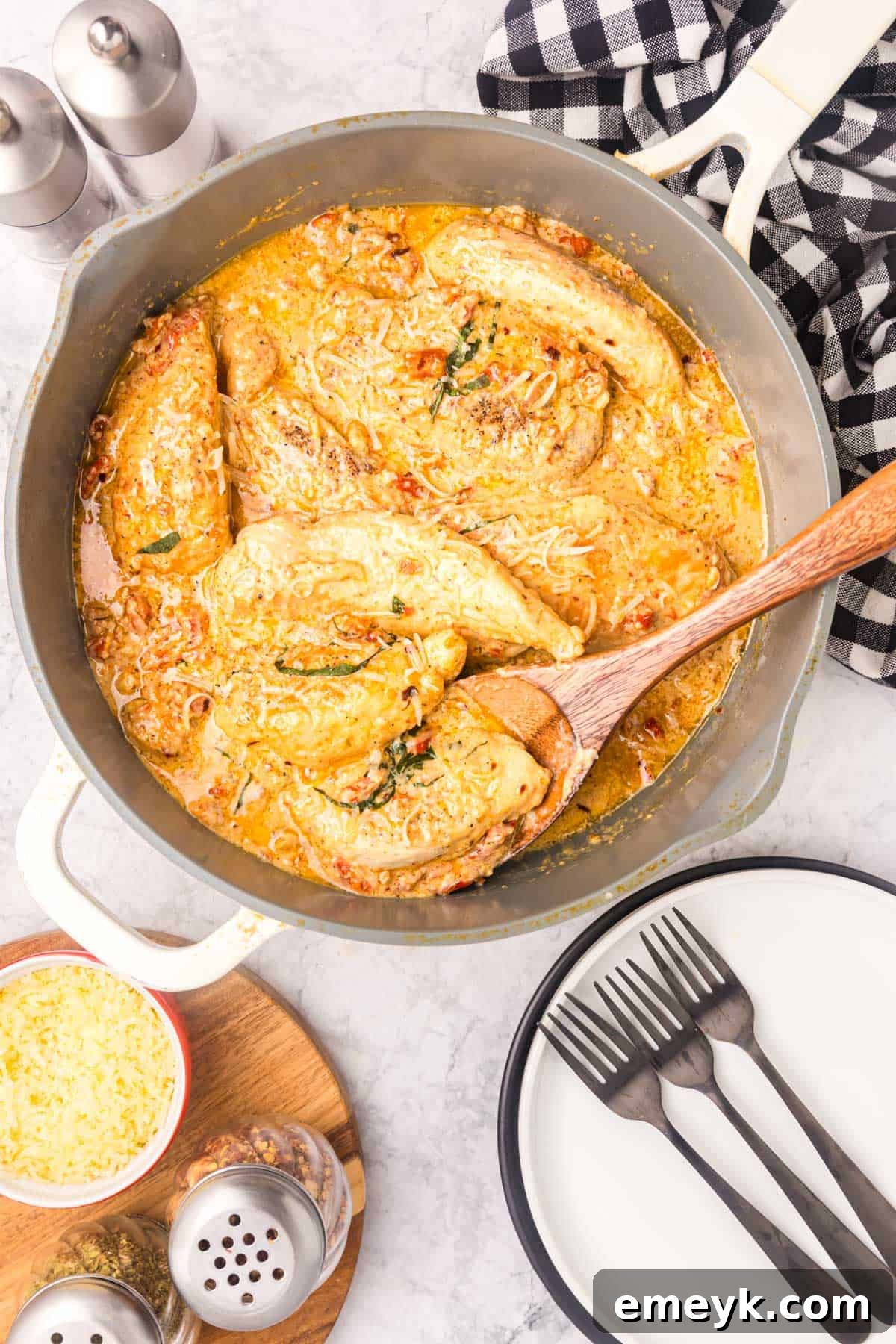Marry Me Chicken simmering in a large skillet, with the sauce thick and bubbly, ready to be served.