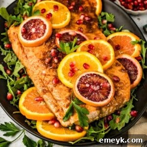 Close-up of baked Orange Glazed Salmon with orange slices.