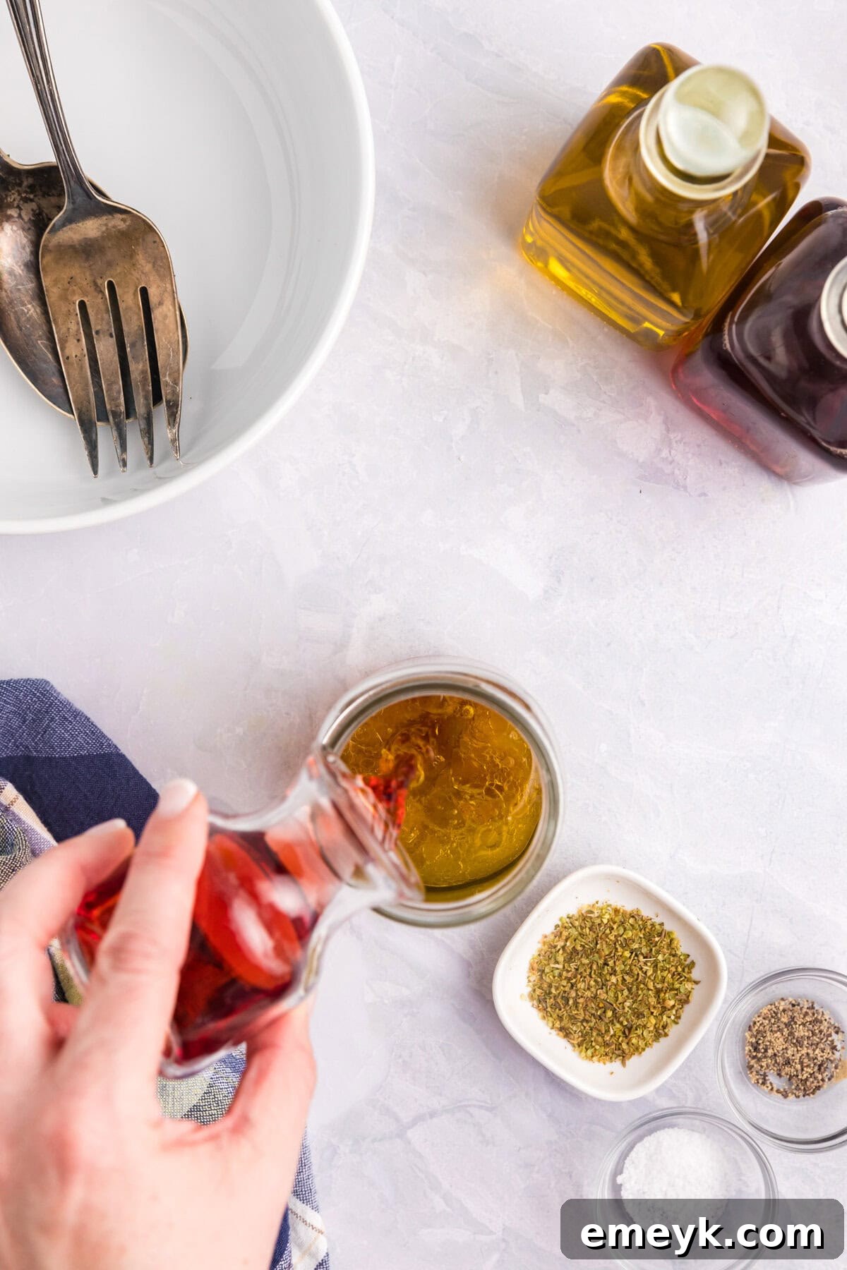 Mediterranean Pasta Salad dressing being prepared in a jar