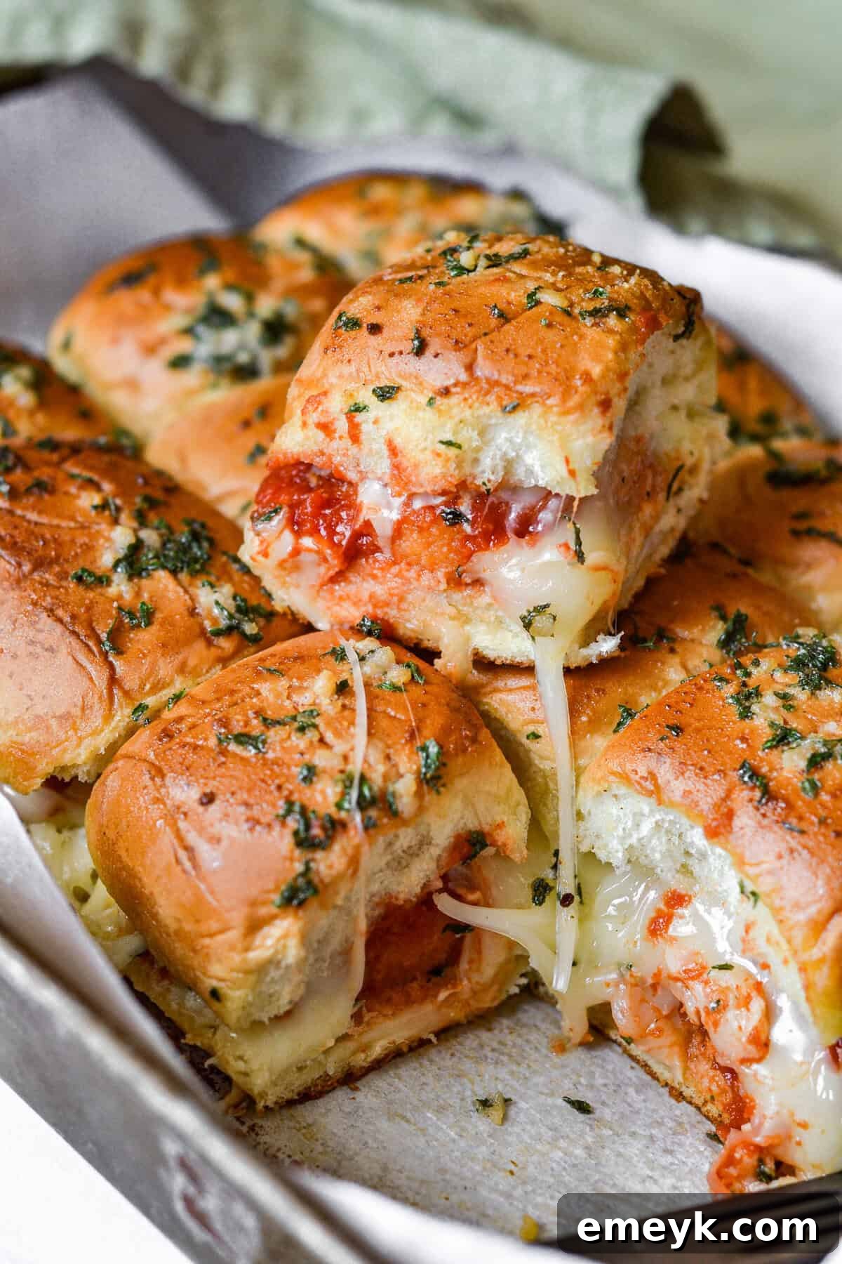 Baked Easy Chicken Parmesan Sliders on a baking sheet ready to serve