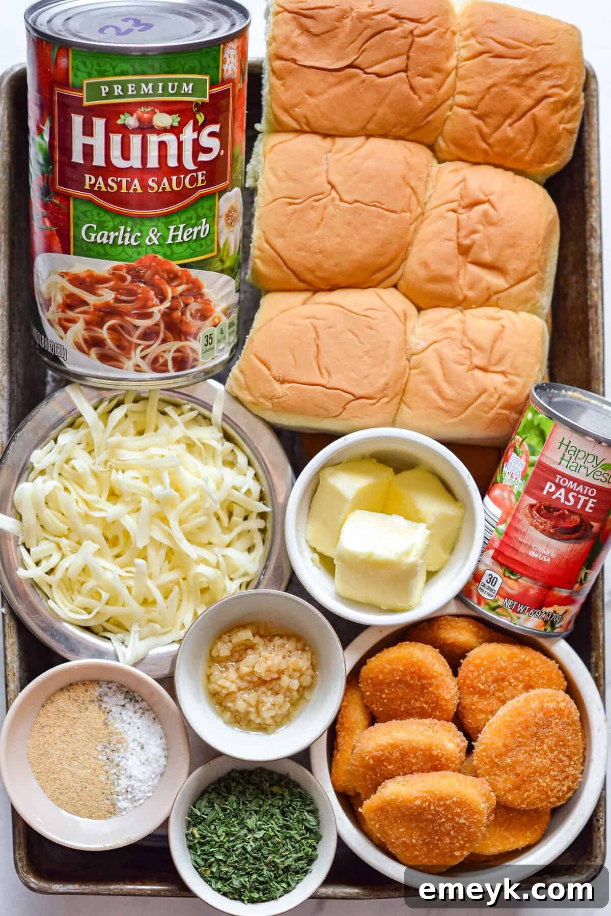 Easy Chicken Parmesan Sliders ingredients on a cutting board