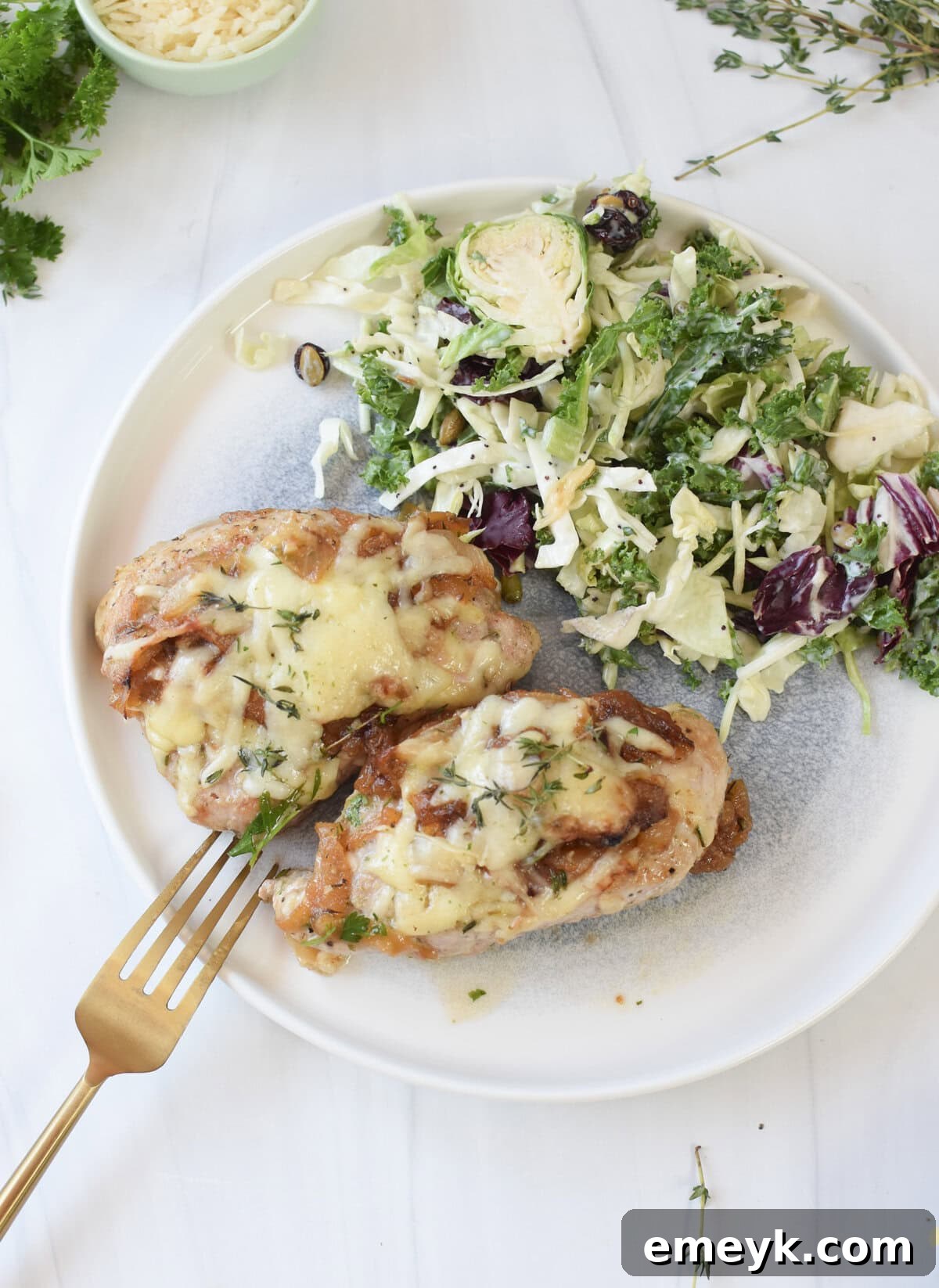 French Onion Smothered Pork Chops 10 Plated French Onion Pork Chops served with a fresh, vibrant green side salad