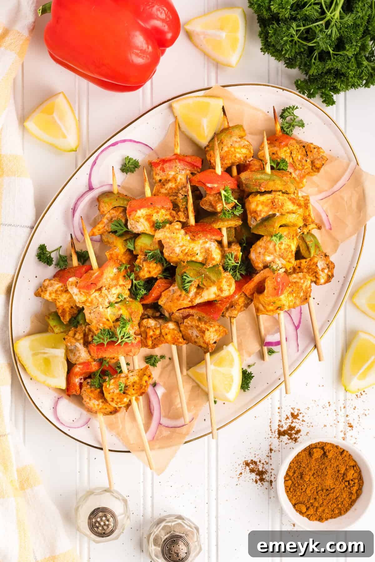 A freshly cooked Chicken Tikka Kebab displayed on a white plate, highlighting its succulent appearance.