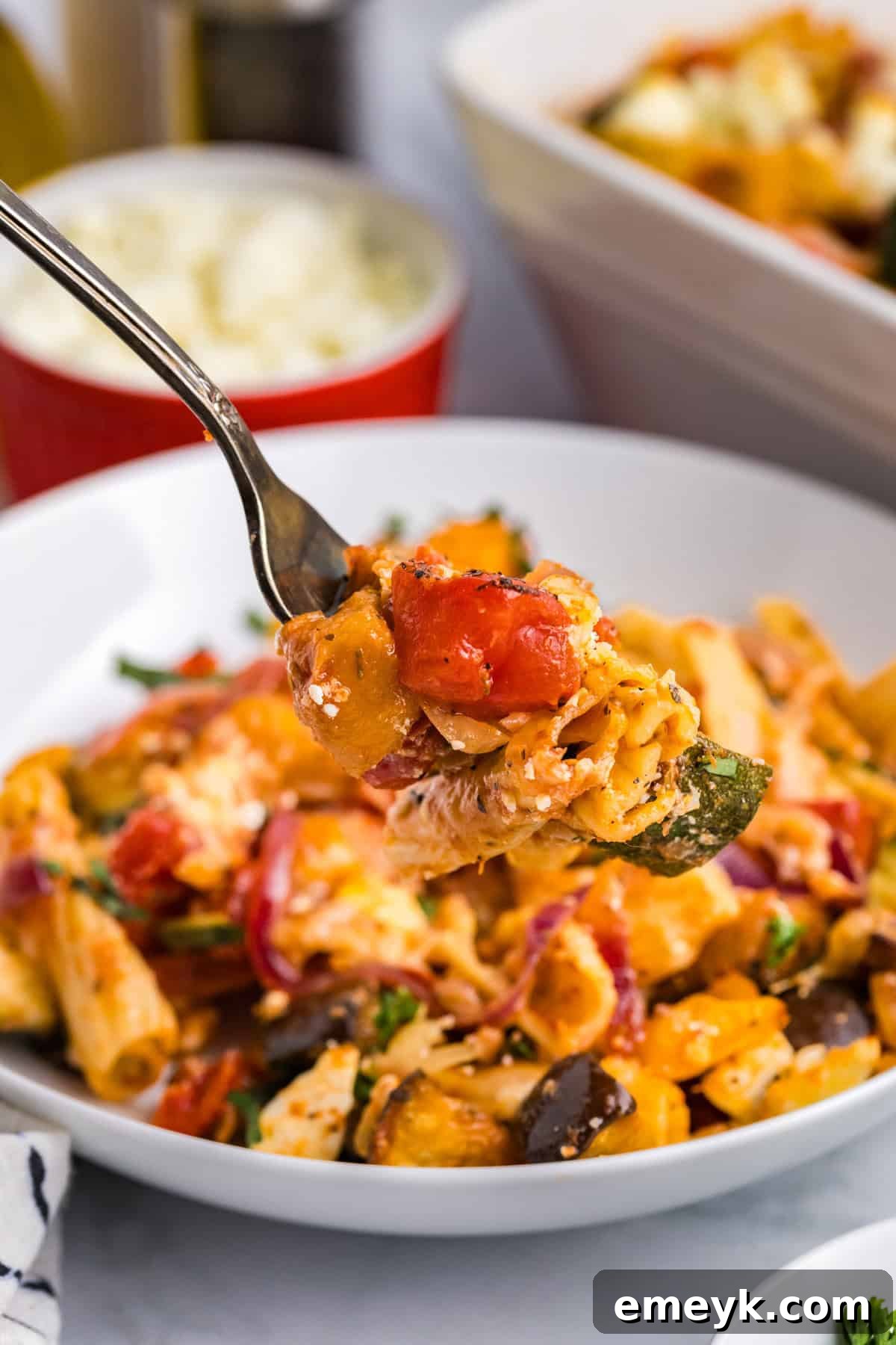 Mediterranean Harvest Roasted Pasta Bake 4 Close-up of Mediterranean Roasted Vegetable Pasta Bake on a fork, showing pasta, vegetables, and melted cheese