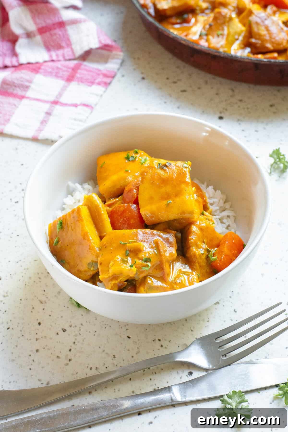Overhead shot of Coconut Fish Curry in a large pan, ready to be served