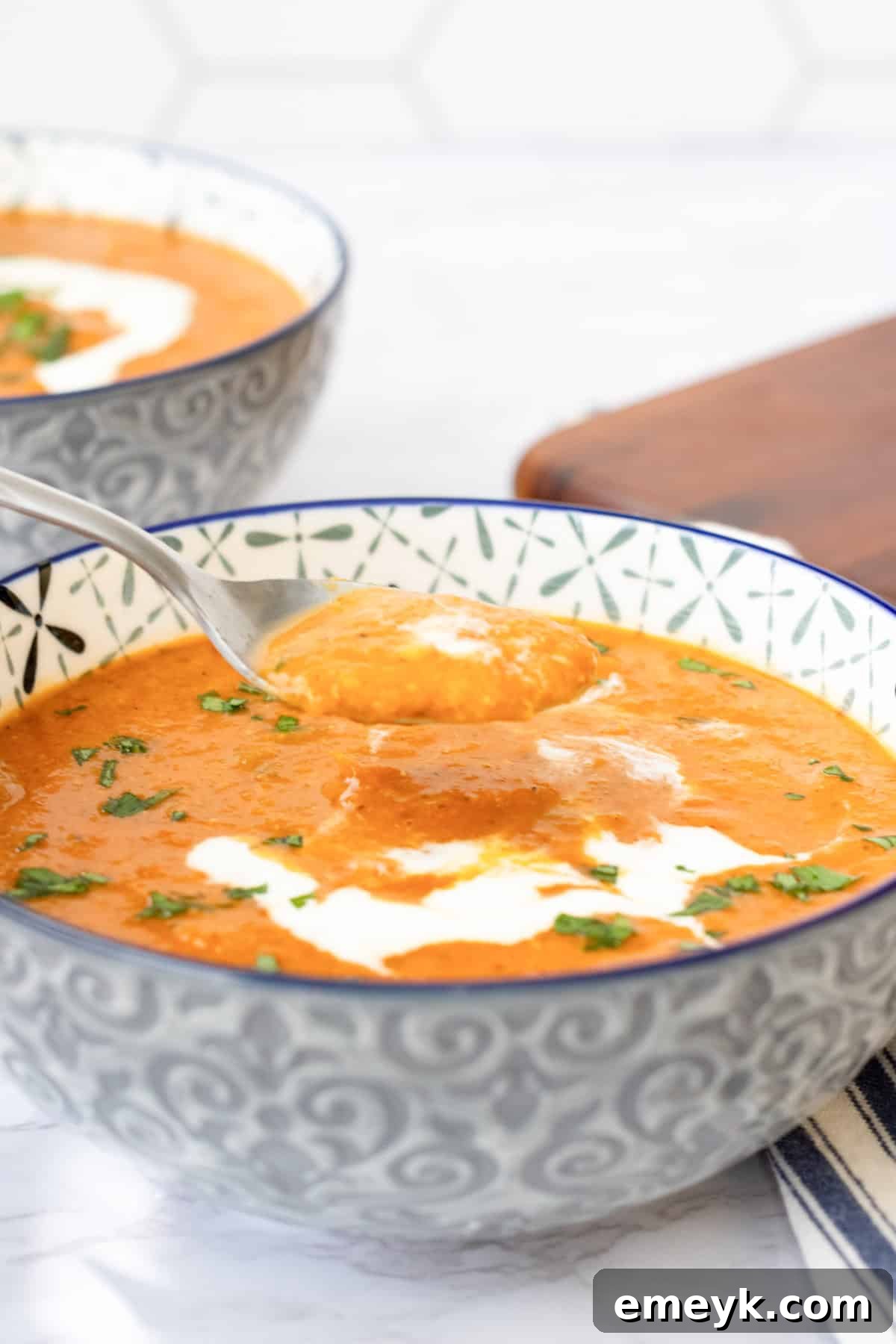 Hearty Tomato Lentil Soup 2 Lentil Tomato Soup with a spoon in the bowl